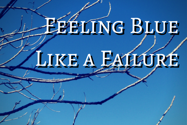 Feeling Blue Like a Failure against blue sky and bare branches